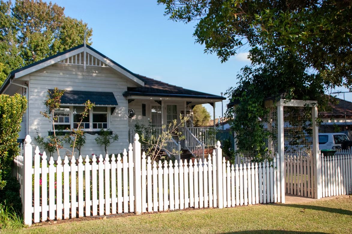Fibro home with a white picket fence, typical of post-war Sydney suburbs